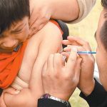 Ouch: an unhappy flu shot recipient.