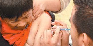 Ouch: an unhappy flu shot recipient.