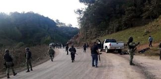 Security forces at the scene of yesterday's gunfight in Guerrero.