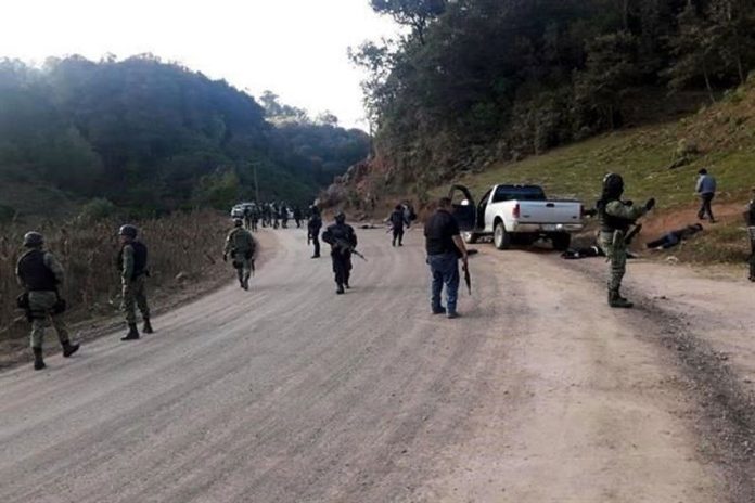 Security forces at the scene of yesterday's gunfight in Guerrero.