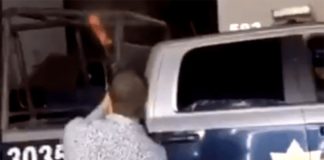 Party time in Sinaloa with a cop's rifle.