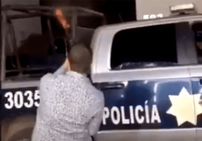 Party time in Sinaloa with a cop's rifle.