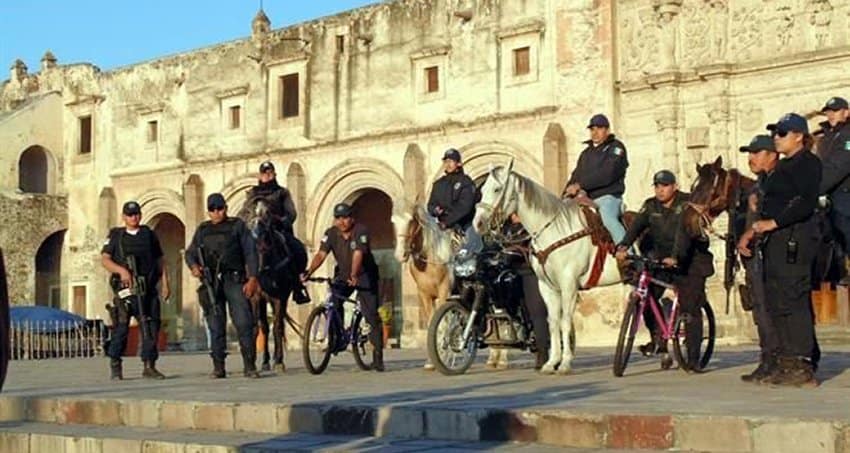 Police in Yuriria, Guanajuato, on bicycles, on horses, on foot.