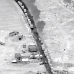 Trucks line up to enter illegal fuel supply depot in Puebla.