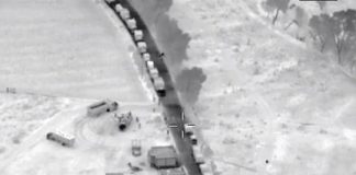 Trucks line up to enter illegal fuel supply depot in Puebla.