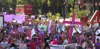 Marchers in Mexico City protest violence against women.