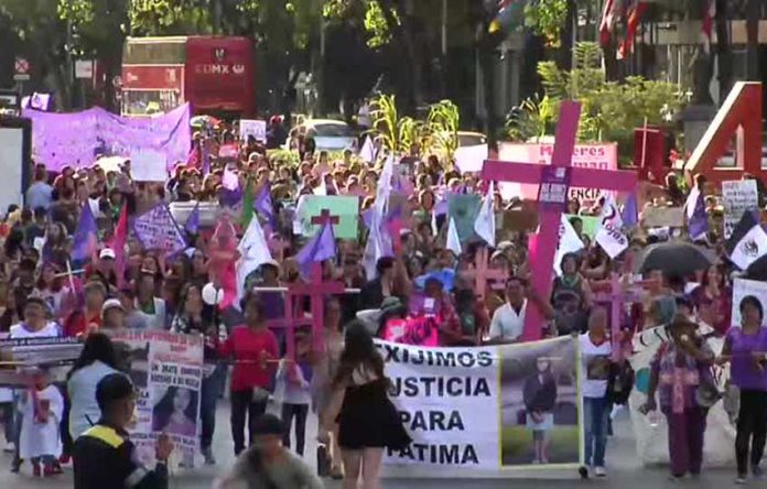 Marchers in Mexico City protest violence against women.