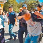 Police arrest a suspect in yesterday's murder.