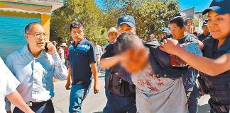 Police arrest a suspect in yesterday's murder.