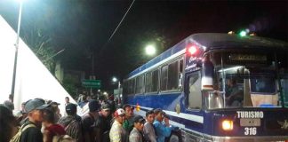 Migrants board a bus in Chiapas.