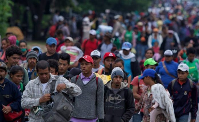 Migrants leave Mexico City this morning.