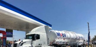 A Mobil tanker truck with a fuel delivery.