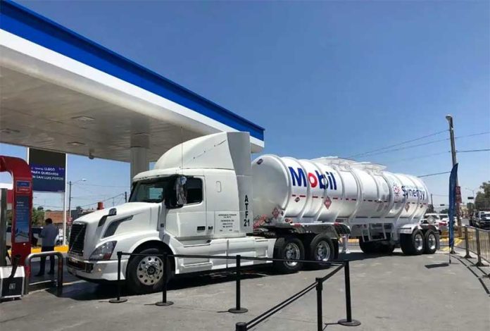 A Mobil tanker truck with a fuel delivery.