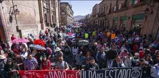 Striking teachers march in Oaxaca city.
