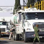 Soldiers check fuel shipments leaving a Pemex storage depot in México state.