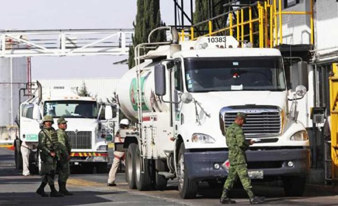Soldiers check fuel shipments leaving a Pemex storage depot in México state.