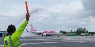 Swoop's inaugural flight to Cancún is baptized on arrival.