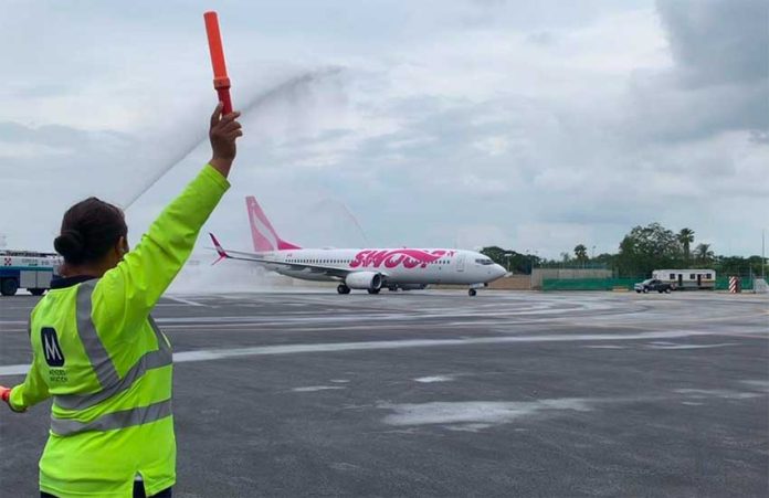 Swoop's inaugural flight to Cancún is baptized on arrival.