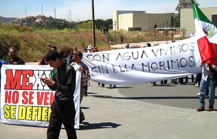 Demonstrators protest against Mexicali brewery.