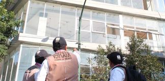 Inspectors check out a building in Mexico City.