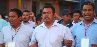 Section 22 leaders at the head of a protest march.