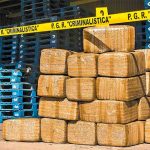 A soldier stands guard over cocaine seized off the coast of Guerrero.
