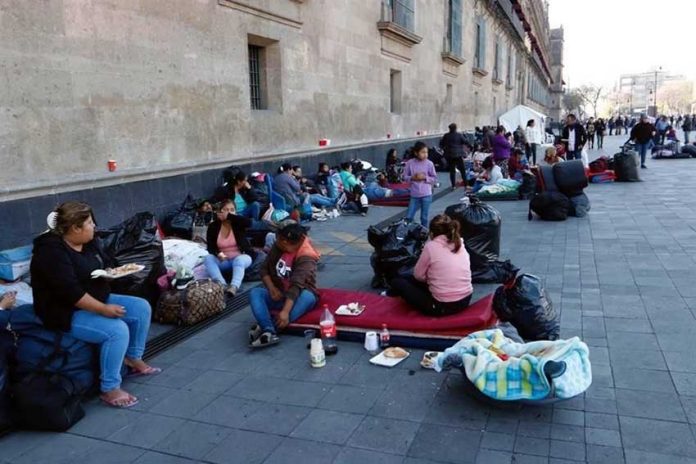 Displaced by violence, citizens from Guerrero camp outside the National Palace.