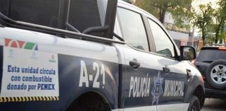 A police vehicle carries a sign indicating its fuel was donated by Pemex. But not all donated fuel went where it was intended.