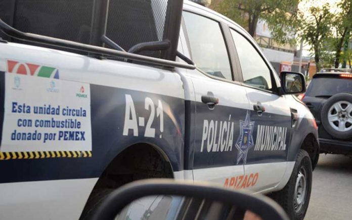 A police vehicle carries a sign indicating its fuel was donated by Pemex. But not all donated fuel went where it was intended.