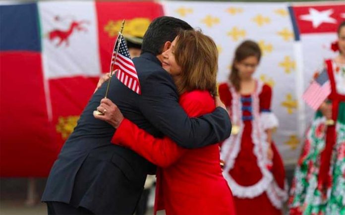 Governor García and Speaker Pelosi hug at the border.