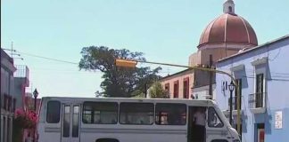 A bus commandeered by teachers blocks a Oaxaca city street.