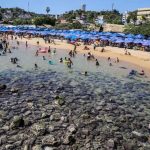 Rocks appear on a beach in Acapulco.