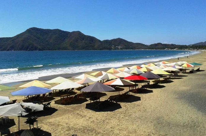 The beach umbrellas are ready for more growth in tourism.