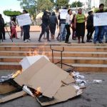 Ballots and documents burn at a polling station in Morelos.