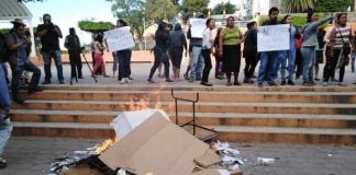 Ballots and documents burn at a polling station in Morelos.