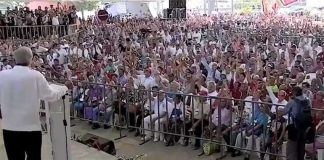 Hands are raised in agreement with a policy of prudence in Mexico's dealings with the US during AMLO's 'public consultation' in Veracruz.