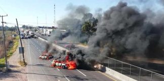Vehicles burn on a Guanajuato highway.