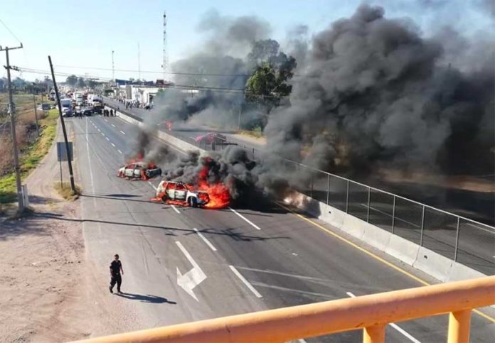 Vehicles burn on a Guanajuato highway.