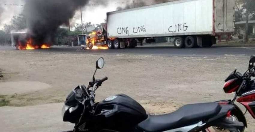 Gangsters left their signature on this trailer before setting it alight.