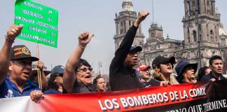 Mexico City firefighters protest earlier this month to demand the resignation of union leader Ismael Figueroa.