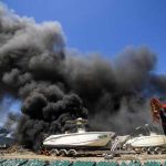 Smoke in San Felipe after clash between fishermen and the navy.