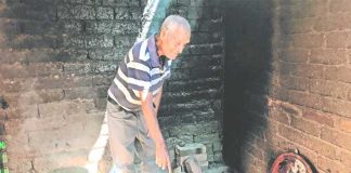 Medina cooks potatoes at his home in Michoacán.