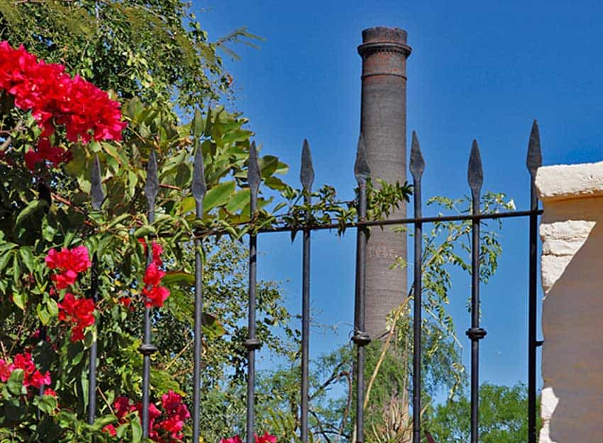 The 154-foot “La Ramona” smelting chimney looms over El Triunfo.