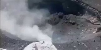 A frame from video footage taken at the volcano El Popo, looking down at the crater.