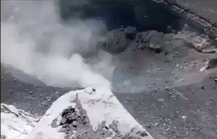 A frame from video footage taken at the volcano El Popo, looking down at the crater.