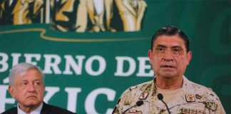 López Obrador listens as Defence Secretary Sandoval discusses advances in Tijuana.