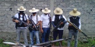 Los Blancos de Troya, suspected of stirring things up in Michoacán, display some firepower in a 2015 photo.