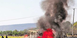 A vehicle burns at a Guanajuato highway blockade yesterday.