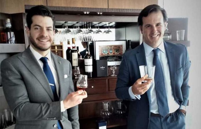 Edrington executive Juan Barbato, left, and Mexico manager Campos toast the Mexican whisky market.