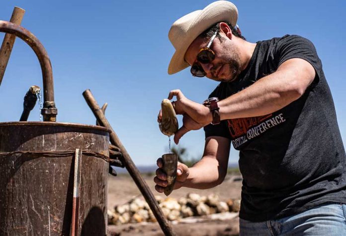 Ricardo Pico uses two horn-shaped vessels to estimate the alcohol content of the sotol he makes at his Chihuahua distillery.